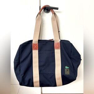 Brand new Dooney & Bourne Canvas Travel 50 in Navy.
